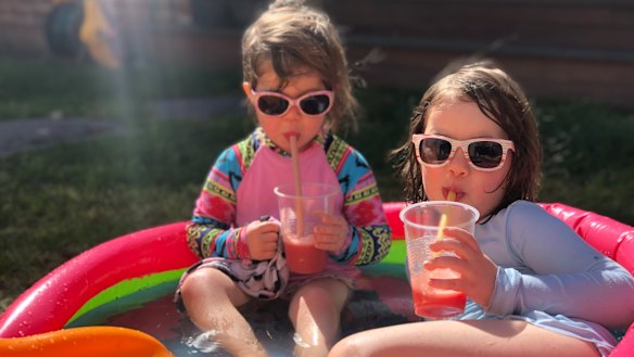 Two young Melburnians enjoy a paddling pool frappé.