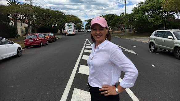 LNP leader Deb Frecklington inspecting a road made up of plastic bags and bottles in Cleveland.