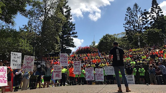 A speaker addresses the CFMEU rally in Brisbane’s Emma Miller Place.