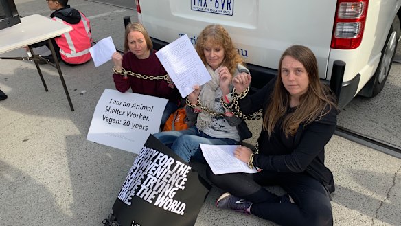 Protestors chained themselves to vans in the middle of the intersection. 