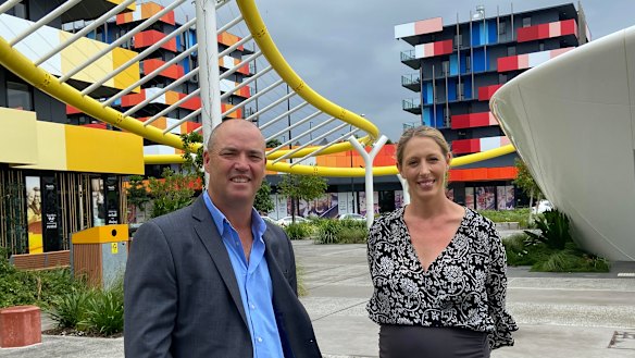 Smith Collective general manager Matt Taplin with marketing manager Alex Slingsby. Seventeen of the 19 former Games village apartment towers are now rented at 80 per cent occupancy.