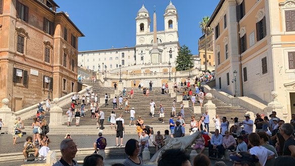 Tourists flock to the Spanish Steps in Rome.