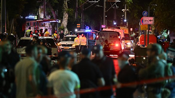 Emergency services near the site of a shooting by gunmen at a light rail station in Tel Aviv, Israel.