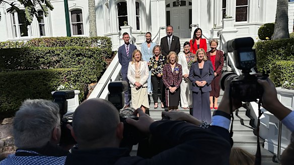 Queensland’s reshuffled ministers (left to right, from back row): Mark Bailey, Meaghan Scanlon, Craig Crawford, Leanne Linard; Yvette D’Ath, Leeanne Enoch, Di Farmer; Premier Annastacia Palaszczuk, Governor Jeannette Young, Shannon Fentiman.