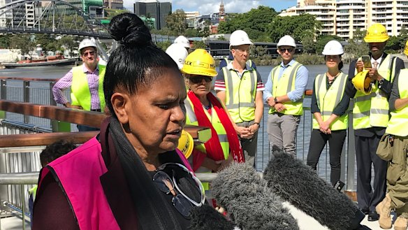 Turrbal woman Maroochy Barambah explains the Aboriginal totems on a new walkway along the Brisbane River.