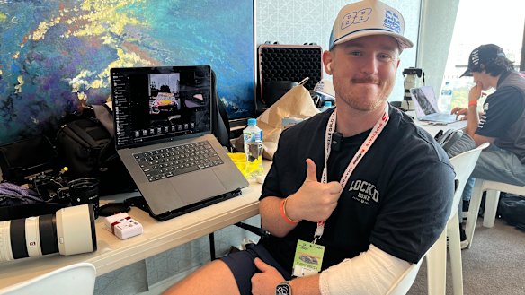 Photographer James Baxter, who returned to work after being injured in a Supercars crash on Saturday.