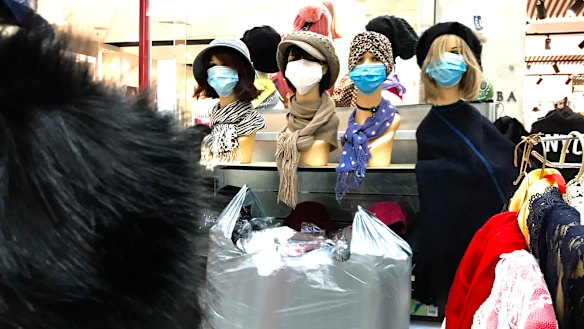 A shop sells masks at a deserted Stocklands Mall in Wetherill Park on Saturday.