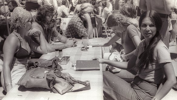 Jim Cairns (centre, face obscured) and Junie Morosi (right) by the pool at the 1975 ALP conference in Terrigal.