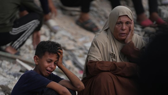 Palestinians mourn during the funeral of people who were killed while trying to reach aid trucks entering northern Gaza through the Zikim crossing with Israel.