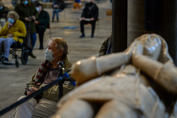 Patients wait in the cathedral’s historic nave for 15 minutes before they are allowed to leave. 