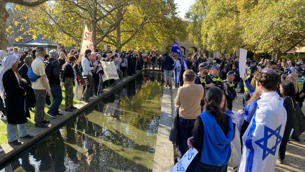 Members of a Jewish rally against antisemitism at the University of Melbourne face off with the pro-Palestine student camp.