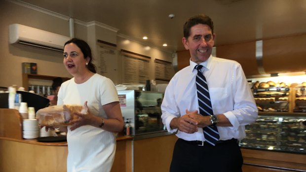 Premier Annastacia Palaszczuk and Treasurer Cameron Dick pick up some bread at a bakery in Woombye. 