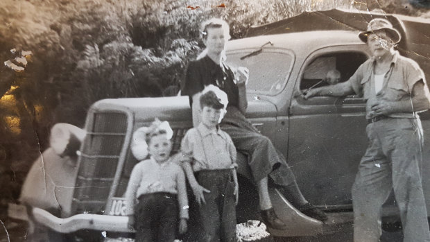 The Robson family (from left, the author, brother Rob, mother Pat and FNick) on the road in NZ’s Northland in the 1950s.