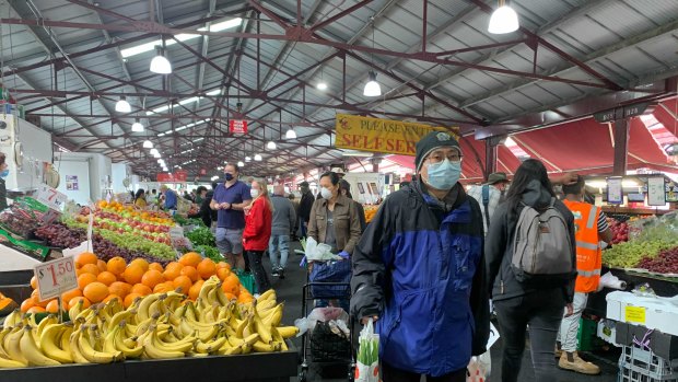 Masked-up Melburnians at Queen Victoria Market’s fruit and vegetable section late last year.