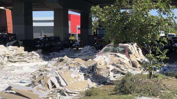 Plasterboard crashed over the bridge and landed on several cars.