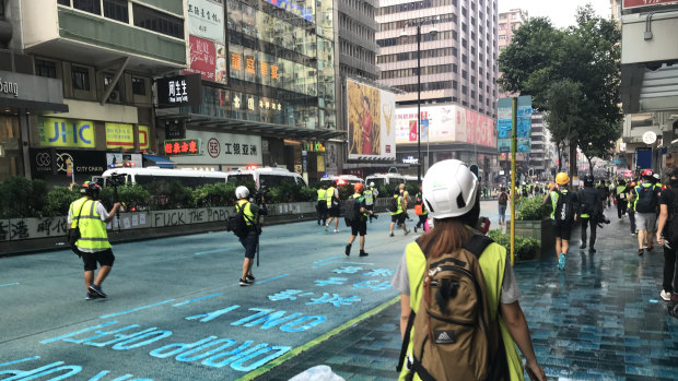 Streets were stained blue from a police water cannon containing blue dye and pepper spray.