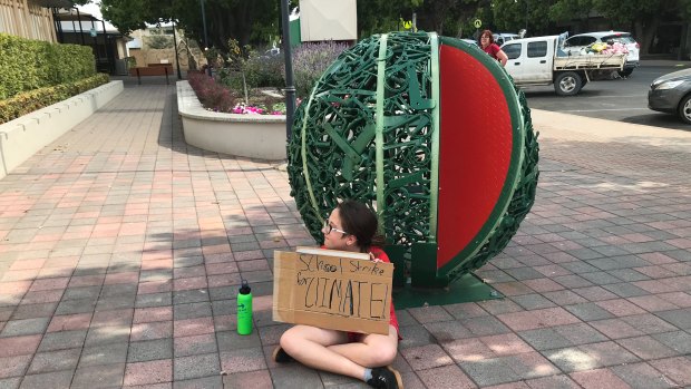 Nearly four hours' drive west of Brisbane at the small town of Chinchilla, Ariel Ehlers staged her own strike outside Chinchilla State School. 