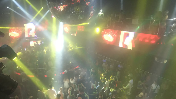 A huge crowd of schoolies and other party goers dance away the early hours of the morning in one of Kuta's many nightclubs, the Sky Garden.