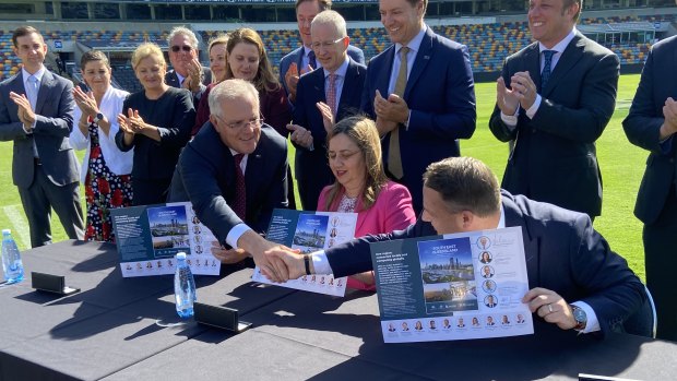 Prime Minister Scott Morrison, Queensland Premier Annastacia Palaszczuk  and Brisbane lord mayor Adrian Schrinner signing the SEQ City Deal at the Gabba.