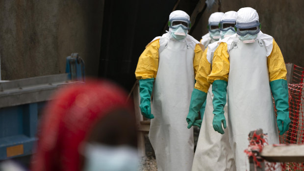 Health workers dressed in protective gear begin their shift at an Ebola treatment centre in Beni in the Democratic Republic of Congo.
