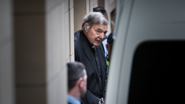 Paedophile George Pell leaves Melbourne's Supreme Court building in handcuffs on Wednesday.