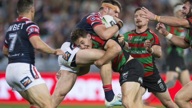 Cameron Murray up-ends Roosters forward Angus Crichton at ANZ Stadium on Thursday night.