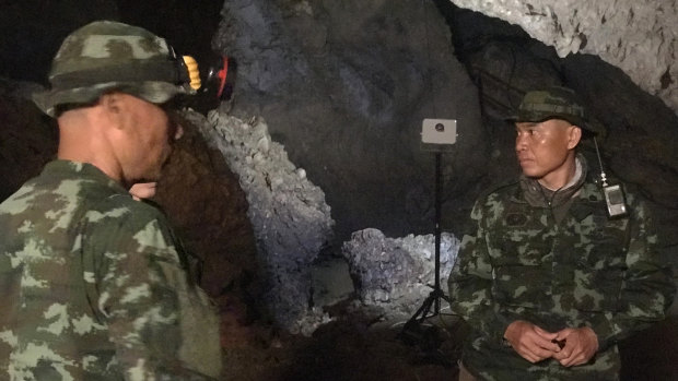 Rescue workers continue to search for a group of missing boys and their coach in a flooded cave in Mae Sai, Chiang Rai province, northern Thailand. 