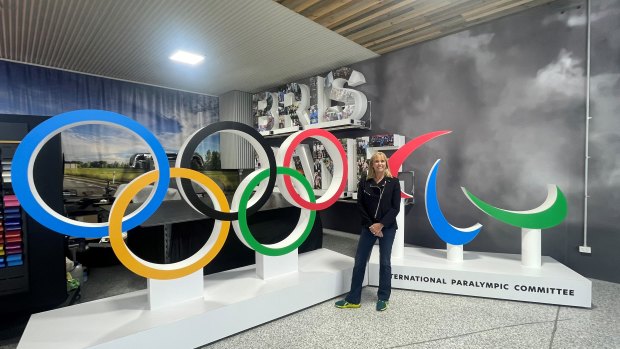 Brisbane 2032 chief executive Cindy Hook with the Olympic rings and agitos.