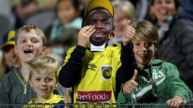 Local hero: Young supporters among the crowd of almost 10,000 in the stands at Central Coast Stadium.