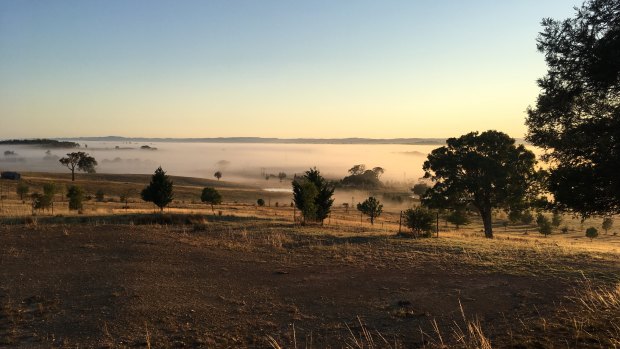 Fog hovering over a pastural valley at Sutton, near Canberra, where a large solar farm is proposed to be built. 