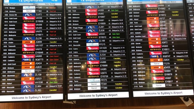 The departures board at T2 Sydney Airport on Friday night. 