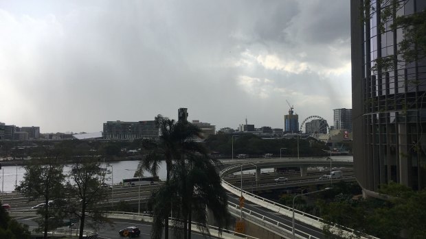 Storms arrive above Parliament House and 1 William Street in Brisbane CBD on Thursday afternoon. 