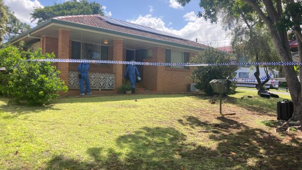 The crime scene at 6 Wobur Street in Bracken Ridge on Monday. Forensic police continue to examine the scene.