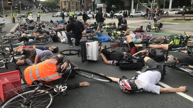 Cyclists staged a "die-in" protest during Brisbane's peak hour traffic on May 2. 