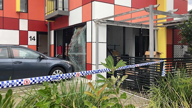 Shattered glass and caved-in glass doors at the cafe.