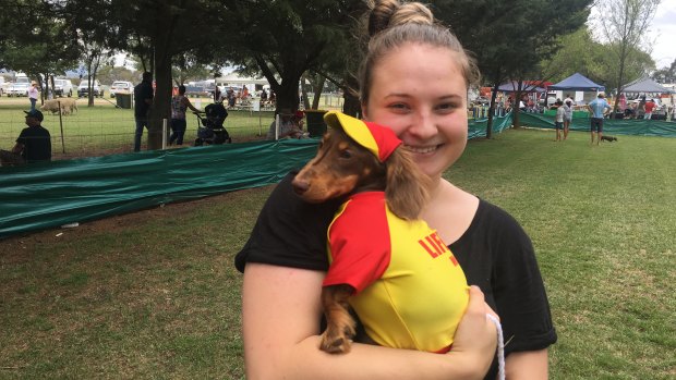 Dressed like a lifesaver, Winston, in the arms of owner Brooke Tierney, won the best dressed category of the "dapper dogs" competition at the Bungendore Show on Sunday.