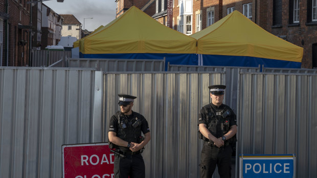 Police secure a point of interest in Salisbury, where counter-terrorism officers are investigating after a woman and her partner were exposed to the nerve agent Novichok. 