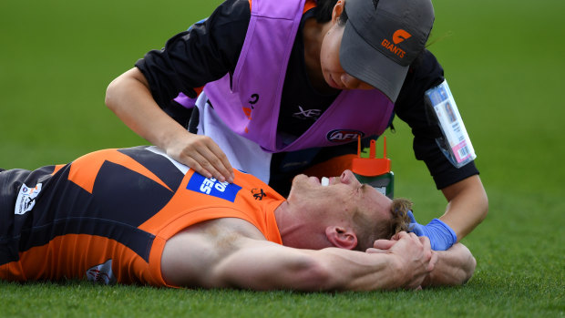 Adam Kennedy is assisted on the field after a head knock.