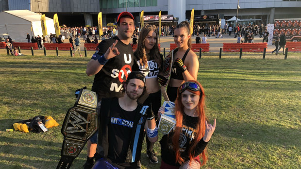 From left: Jarrad Smith, James Michalas, Kirsty Smith, Loretta Cimini, Steph Logan at the MCG for the WWE event.
