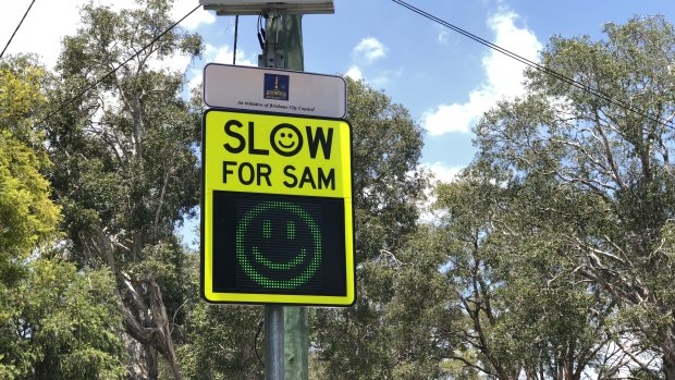 Brisbane City Council's Slow for SAM sign, which gives motorists who obey the speed limit a "smiley face".