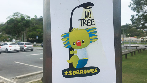 A 'Sorrowbe' sticker on a public shower near Currumbin Creek on the Gold Coast on Tuesday.