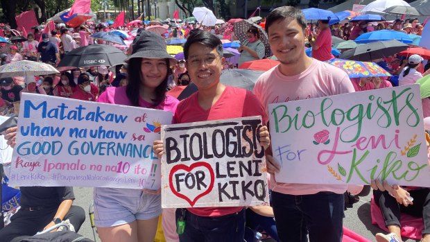 English teacher Hannah Macatao, biologist Glenn Gamus and Daryl Field, an architect, at the Robredo rally on Saturday.