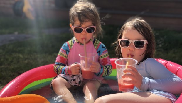 Two young Melburnians enjoy a paddling pool frappé.
