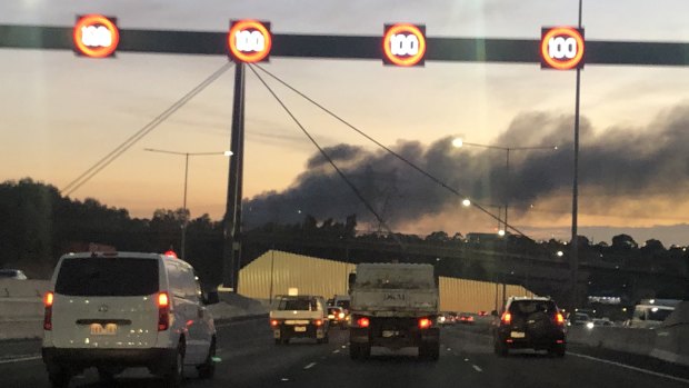 Plumes of smoke from a factory fire in Campbellfield on the approach to Melbourne early on Friday.