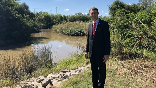 Lord mayor Graham Quirk at the edge of Oxley Creek within the Oxley Creek Transformation project redevelopment area.