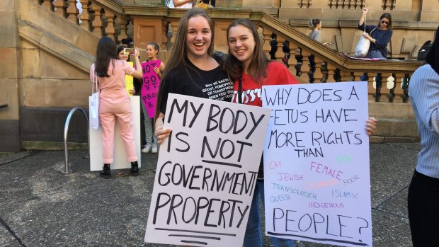 Classmates Tara Fabris and Amber Kelly (left) attended the rally in fear that law changes in the US will make their way to  Australia. 