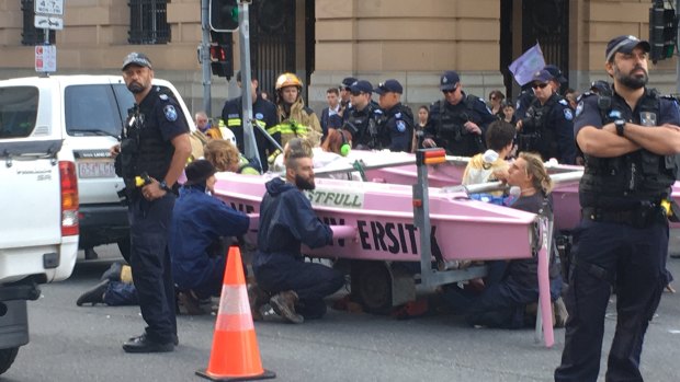 About 20 police were working to move the boat, at the Elizabeth and George streets intersection in Brisbane.