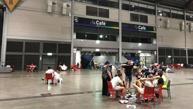 Temporary home: Affected residents inside the Sydney Showgrounds' exhibition hall late on Monday evening. 