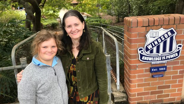 Alison Courtice from Queensland Parents for Secular State Schools with her Year 5 daughter Lauren at Windsor State School. She is calling for religious instruction courses to be replaced by studies of the world's religions. 