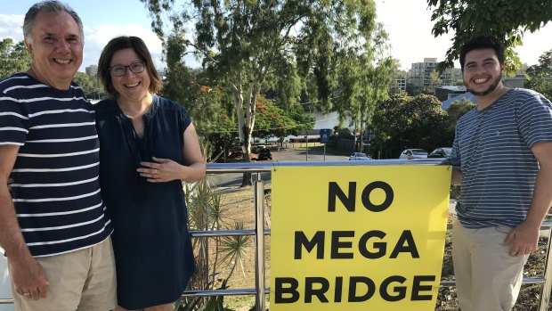 Boundary Street households are worried about an option to run a green bridge between St Lucia and West End. Jim Paltoglou (left), his wife Des and son Aleko face losing their home if Option C goes ahead.